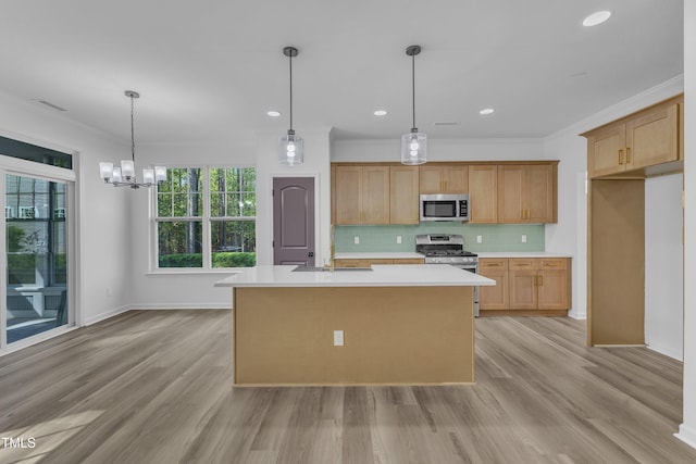 kitchen featuring crown molding, decorative backsplash, light countertops, and stainless steel appliances