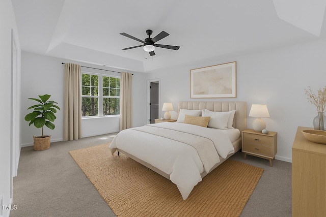 858 Lake Artesia Ln, Fuquay Varina, NC 27526 - bedroom featuring carpet flooring, baseboards, a tray ceiling, and ceiling fan
