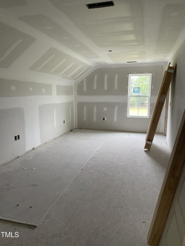 bonus room featuring vaulted ceiling