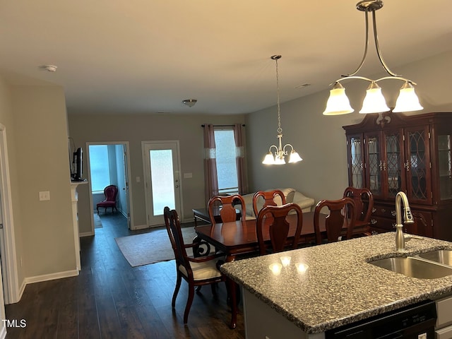 48 Cullen Ct, Clayton, NC 27520 - dining room with plenty of natural light, a notable chandelier, baseboards, and dark wood-style floors