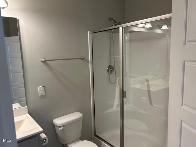 48 Cullen Ct, Clayton, NC 27520 - bathroom with a shower stall, vanity, and toilet