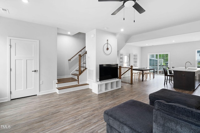living room with wood finished floors, recessed lighting, and ceiling fan