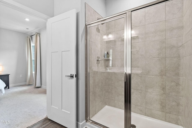 full bath with baseboards and a stall shower