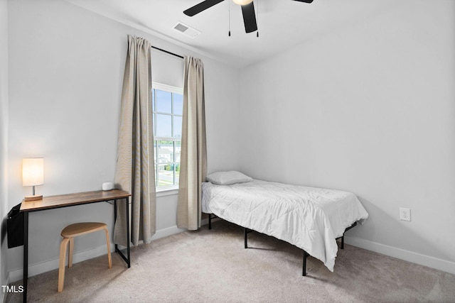bedroom featuring carpet flooring, multiple windows, and visible vents
