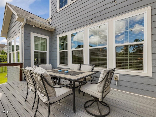 wooden deck with outdoor dining space