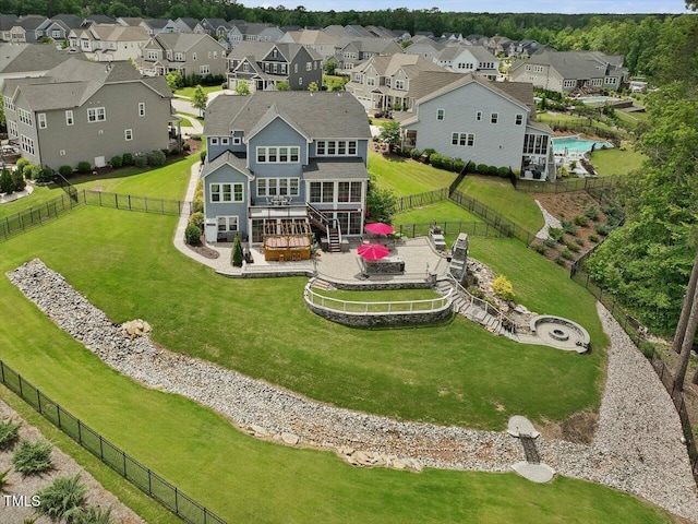 aerial view of residential area featuring a pool area
