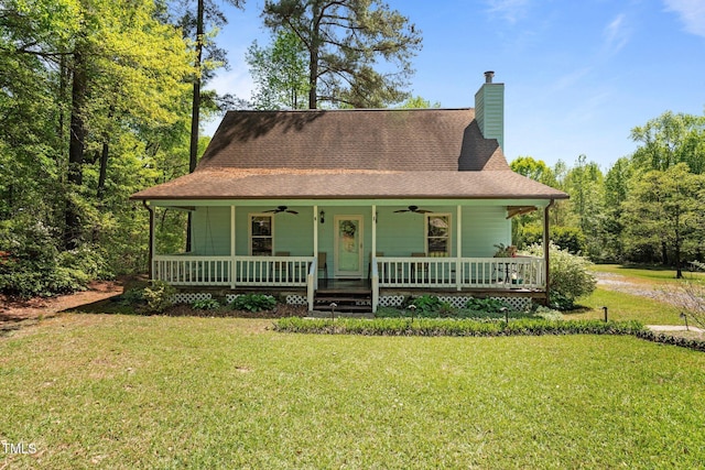 209 Pen Lou Ct, Angier, NC 27501 - farmhouse inspired home featuring a ceiling fan, a porch, a front yard, a chimney, and a shingled roof