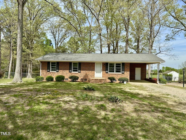 1031 Jackson Royster Rd, Henderson, NC 27537 - ranch-style home with a carport, driveway, fence, and a front lawn