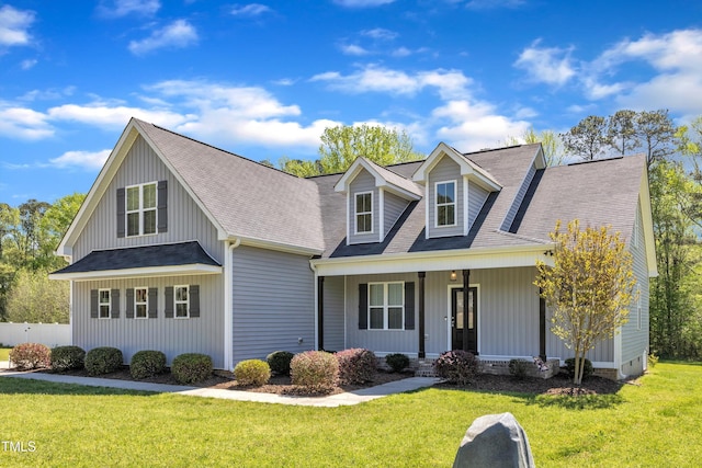 1077 Williams-White Rd, Zebulon, NC 27597 - view of front of home featuring a front yard, roof with shingles, and covered porch