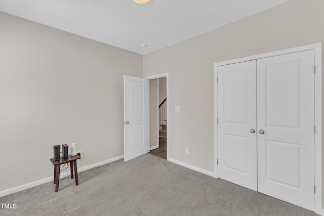 1077 Williams-White Rd, Zebulon, NC 27597 - unfurnished bedroom with a closet, baseboards, and carpet