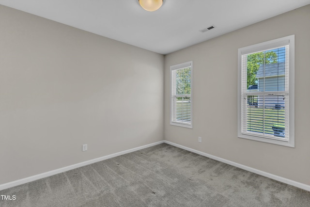 1077 Williams-White Rd, Zebulon, NC 27597 - spare room featuring carpet flooring, baseboards, and visible vents