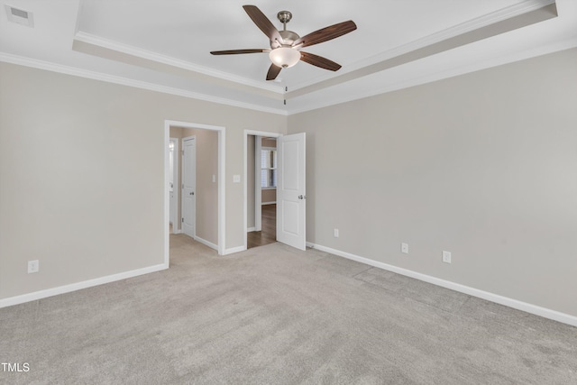 1077 Williams-White Rd, Zebulon, NC 27597 - unfurnished room featuring visible vents, a raised ceiling, ornamental molding, ceiling fan, and light colored carpet