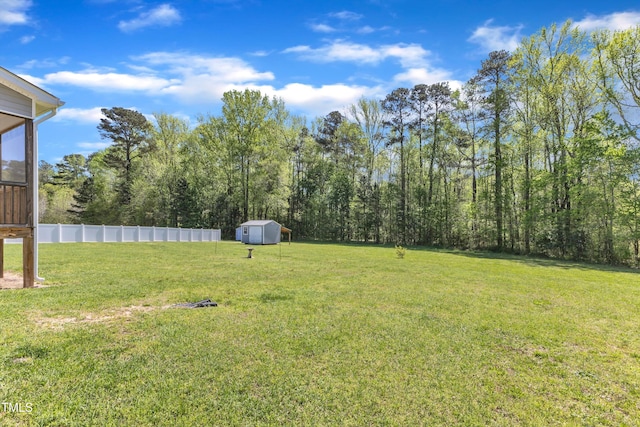 1077 Williams-White Rd, Zebulon, NC 27597 - view of yard featuring an outdoor structure, fence, and a storage unit