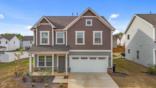 7205 Tillage Rd, Mebane, NC 27302 - view of front of house with concrete driveway, stone siding, board and batten siding, and a garage
