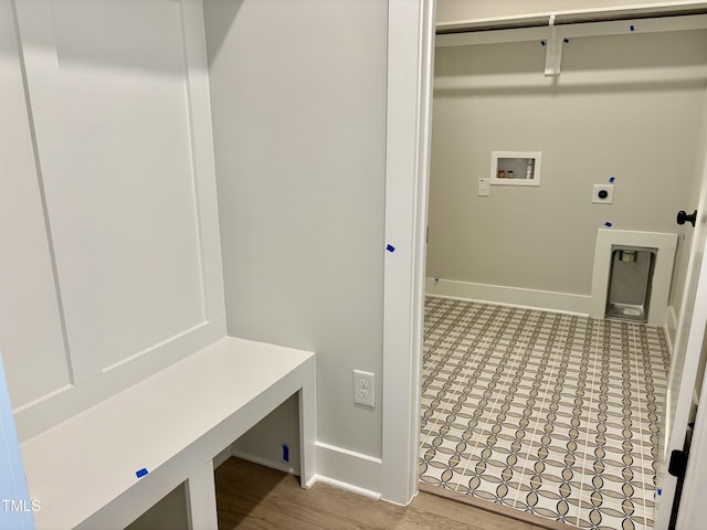laundry room with baseboards, hookup for an electric dryer, laundry area, and washer hookup