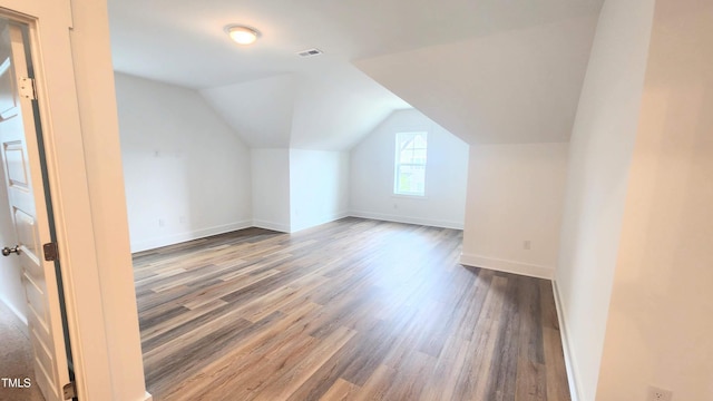 1237 Porters Call Dr, Wendell, NC 27591 - bonus room featuring wood finished floors and lofted ceiling