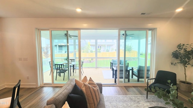 1237 Porters Call Dr, Wendell, NC 27591 - living room featuring wood finished floors, a ceiling fan, and recessed lighting