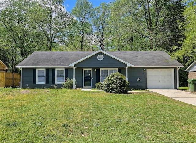 ranch-style home with a front lawn, fence, a garage, and concrete driveway