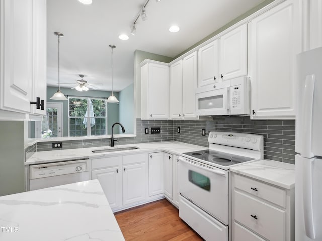 kitchen featuring a sink, ceiling fan, white cabinets, and white appliances