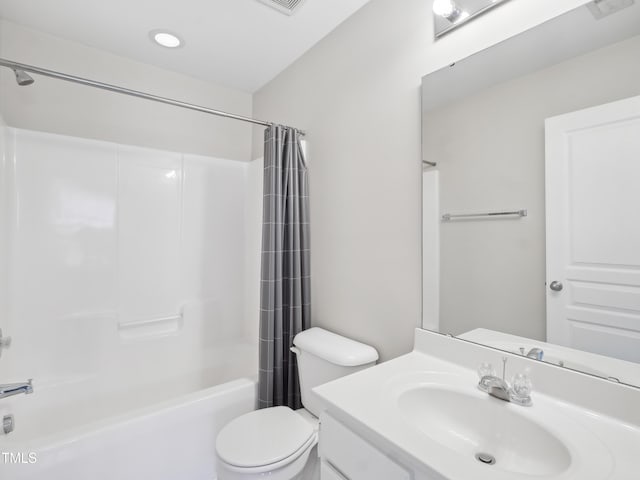 full bathroom featuring vanity, shower / bath combo, toilet, and visible vents