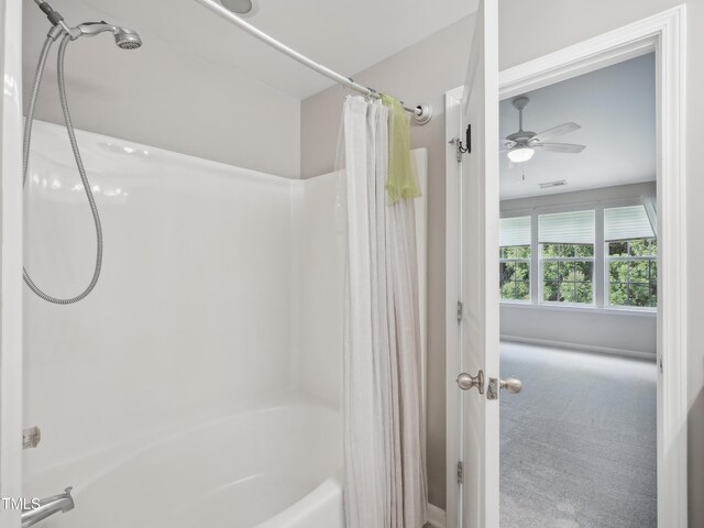 bathroom with visible vents, a ceiling fan, and shower / tub combo with curtain