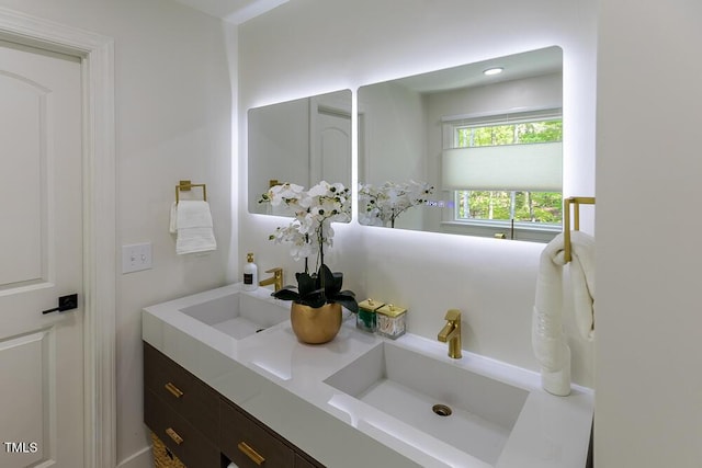 bathroom featuring double vanity and a sink