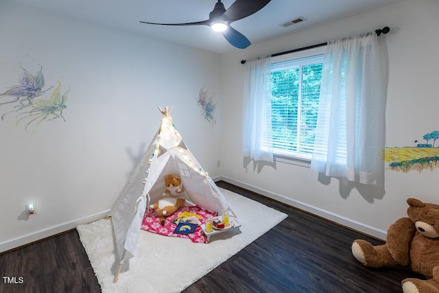 game room featuring baseboards, wood finished floors, and ceiling fan