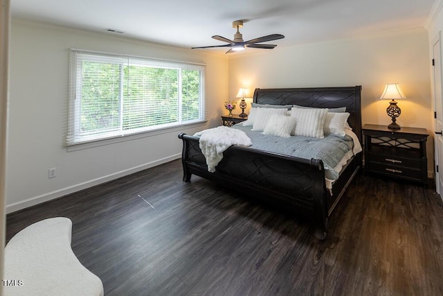 bedroom featuring ornamental molding, wood finished floors, baseboards, and ceiling fan