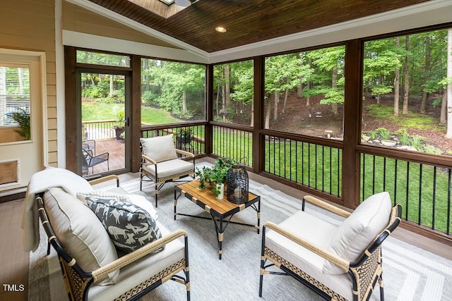 sunroom / solarium featuring lofted ceiling and an outdoor hangout area
