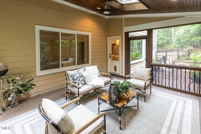 sunroom / solarium with a skylight and an outdoor hangout area