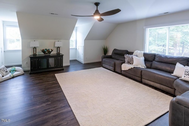 living area with a ceiling fan, dark wood-style floors, baseboards, and lofted ceiling