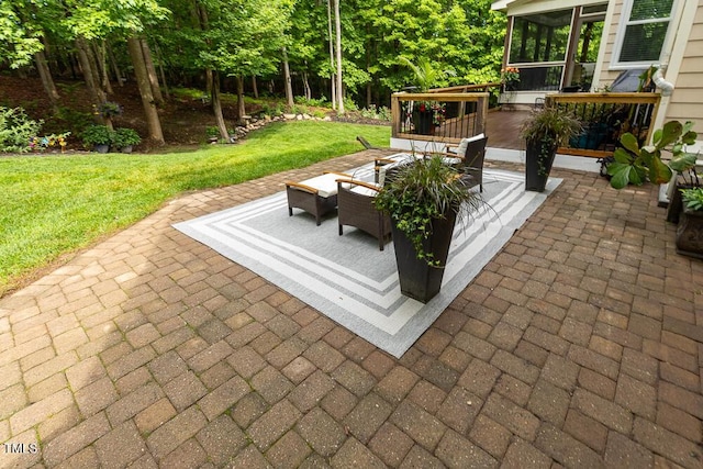 view of patio / terrace with a sunroom and an outdoor hangout area
