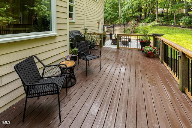 wooden deck featuring fence