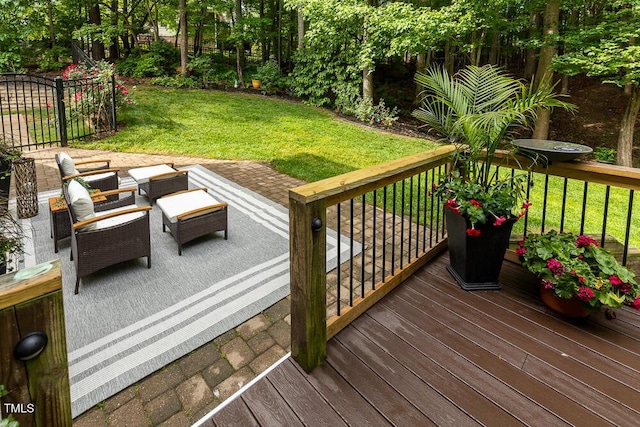 wooden deck featuring a yard and an outdoor living space