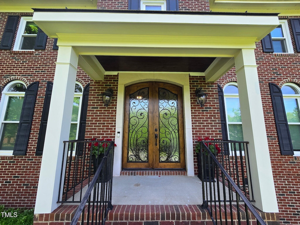 5025 Martin Farm Rd, Raleigh, NC 27613 - entrance to property with brick siding and french doors