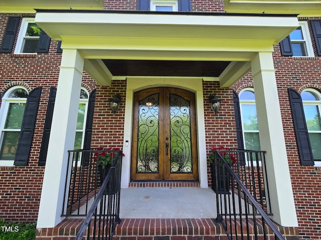 5025 Martin Farm Rd, Raleigh, NC 27613 - doorway to property with brick siding and french doors
