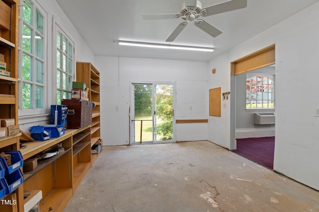 373 Sagamore Dr, Louisburg, NC 27549 - spare room featuring ceiling fan, a wall unit AC, and concrete flooring