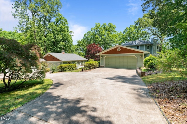 373 Sagamore Dr, Louisburg, NC 27549 - view of front of home with a garage and driveway