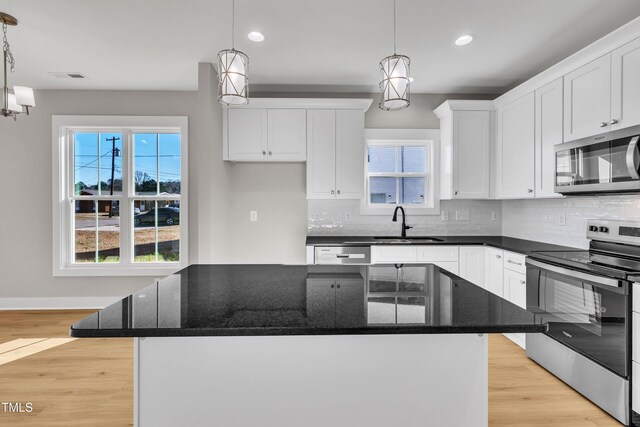 617 Ray St, Selma, NC 27576 - kitchen featuring recessed lighting, backsplash, and stainless steel appliances