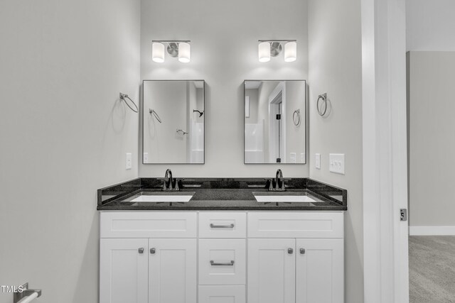 617 Ray St, Selma, NC 27576 - bathroom featuring double vanity, baseboards, and a sink