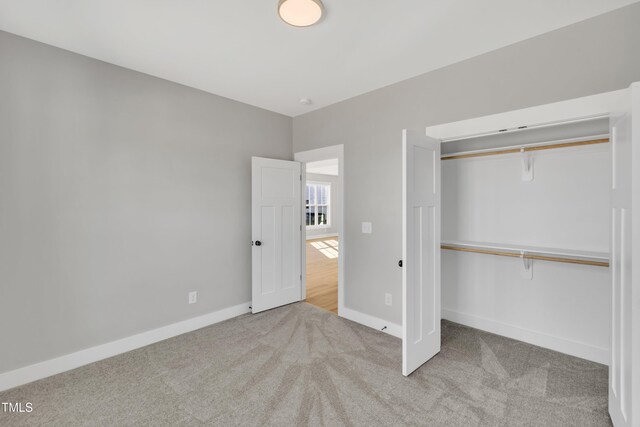617 Ray St, Selma, NC 27576 - unfurnished bedroom featuring a closet, baseboards, and carpet floors