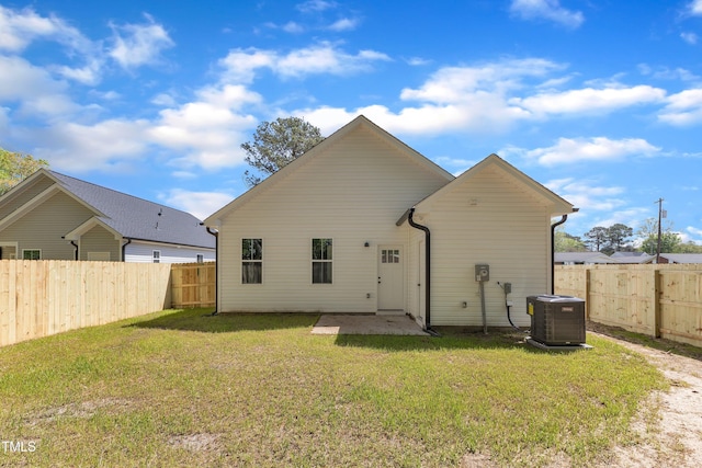 617 Ray St, Selma, NC 27576 - back of property with central AC, a fenced backyard, and a lawn