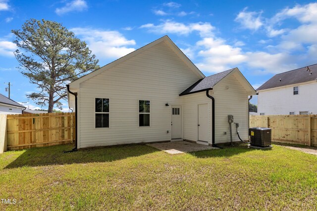 617 Ray St, Selma, NC 27576 - back of house featuring central AC unit, fence private yard, and a lawn