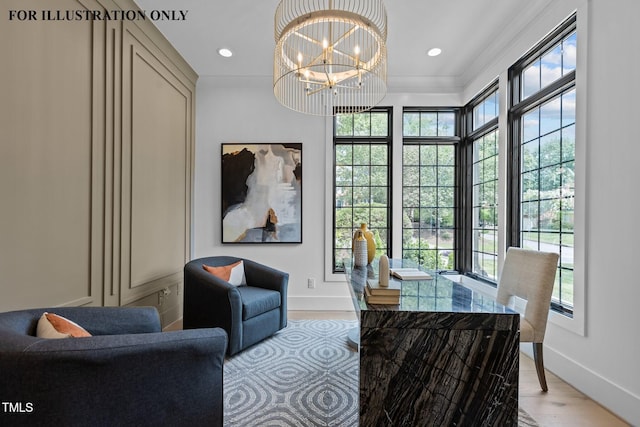 living area featuring a wealth of natural light, recessed lighting, a notable chandelier, and baseboards