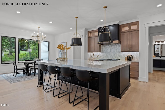 kitchen featuring recessed lighting, tasteful backsplash, light wood-style floors, and a spacious island