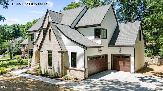 view of front of property featuring concrete driveway, a garage, and a shingled roof