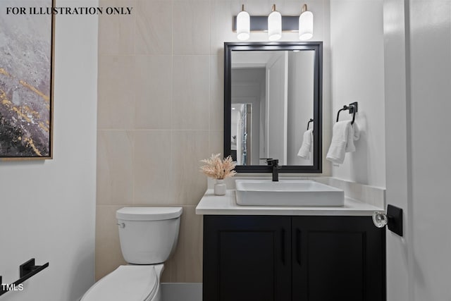 bathroom featuring toilet, vanity, and tile walls