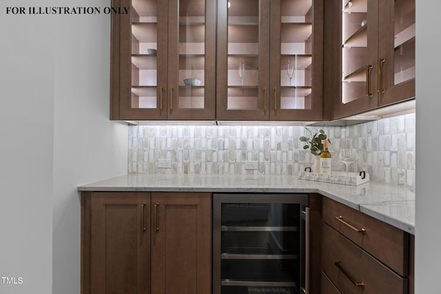 bar with tasteful backsplash, beverage cooler, and a dry bar