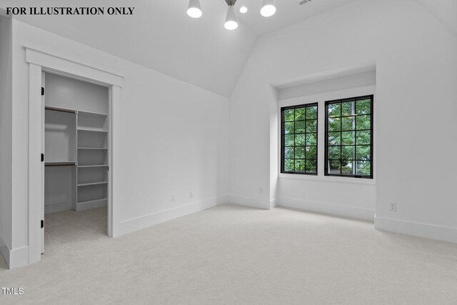 unfurnished bedroom with a spacious closet, carpet flooring, baseboards, and vaulted ceiling