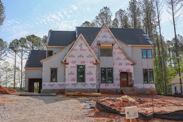 view of front of home featuring a shingled roof